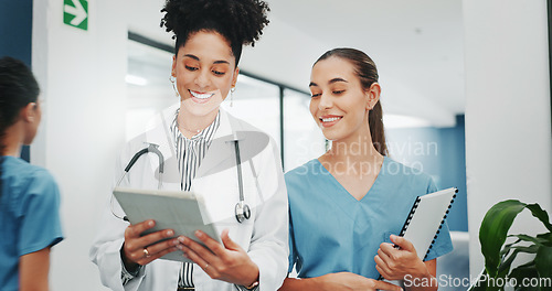 Image of Women doctors, talking or walking in hospital in teamwork, nurse collaboration or surgery research. Smile, happy or healthcare workers in planning, communication or discussion for medicine treatment