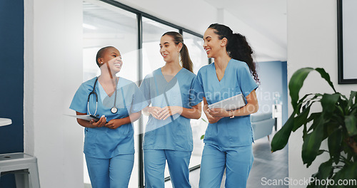 Image of Talking nurses, walking and documents in hospital teamwork, diversity collaboration or bonding on surgery or clinic break. Smile, happy and healthcare women with medical research, paper or funny joke