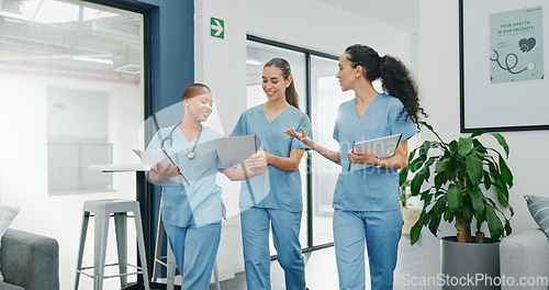 Image of Talking nurses, walking and documents in hospital teamwork, diversity collaboration or bonding on surgery or clinic break. Smile, happy and healthcare women with medical research, paper or funny joke