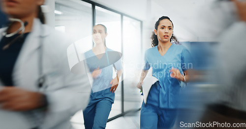 Image of Doctors, nurses or running in hospital emergency, patient crisis or pager call in ICU stress, trauma fail or diversity clinic. Healthcare women, rushing or run in medical hallway to code blue problem