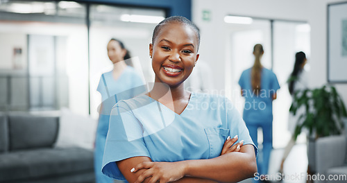 Image of Nurse, face or arms crossed in busy hospital for about us, medical life insurance or wellness support. Smile, happy or healthcare black woman in portrait, confidence trust or help medicine internship