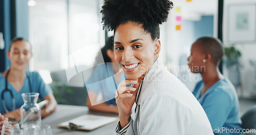 Image of Woman, face or doctor in teamwork meeting, medical leadership or life insurance planning in hospital boardroom. Smile, worker or healthcare portrait in diversity, collaboration or clinic presentation