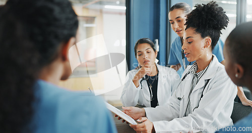 Image of Doctors, nurse and women on clipboard in meeting, collaboration or teamwork for hospital planning, medical or life insurance. Talking, leadership and healthcare workers on paper in diversity research