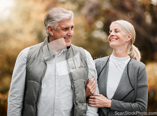 Image of Happy, love and peace with old couple in nature for bonding, relax and support. Smile, happiness and retirement with senior man and woman walking in countryside park for vacation and commitment