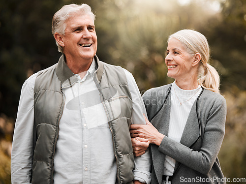 Image of Relax, love and peace with old couple in nature for bonding, happy and support. Smile, happiness and retirement with senior man and woman walking in countryside park for vacation and commitment