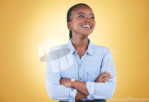 Image of Thinking, smile and happy black woman confident arms crossed isolated in a studio yellow background. African, fashion and relax young person proud of style with a memory of joy, humor and fun