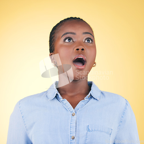 Image of Thinking, wow and black woman with surprise, announcement and girl on a yellow studio background. Person, omg and model with expression, shocked and winner with giveaway, news and discount deal