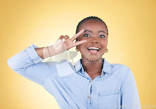 Image of Crazy, portrait and a black woman with a peace sign on a studio background for fun personality. Cool, happy and an African girl or young person with a comic hand gesture isolated on a studio backdrop