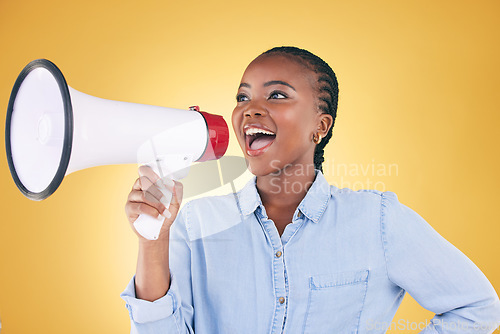 Image of African woman, megaphone and shout in studio with speech, ideas and thinking by yellow background. Girl, student and activist with loudspeaker for voice, sound and call for justice, protest or rally