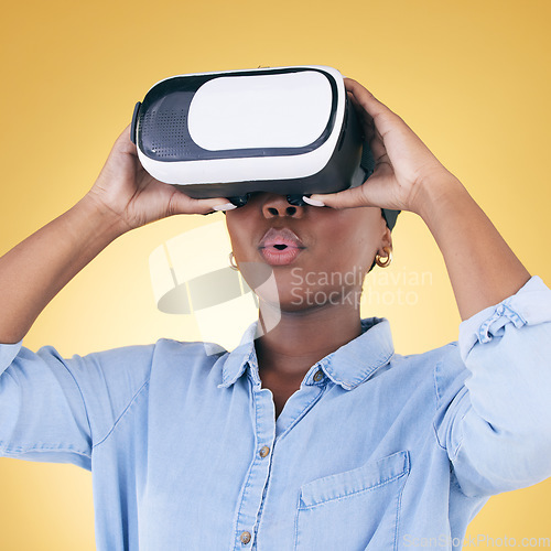 Image of Black woman, surprise and virtual reality, metaverse and futuristic technology isolated on yellow background. VR goggles, wow and experience, digital world and gaming with cyber software in a studio