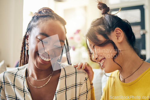 Image of Happy, laugh and friends gossip, speaking and bond with joke, humor and story in their home. Smile, funny and women with diversity in a living room share drama, chat and silly, talk and enjoy weekend