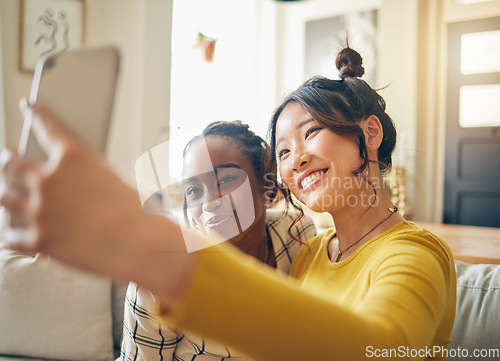 Image of Social media, friends and selfie with women in living room for happy, relax and diversity. Smile, happiness and profile picture with people on sofa at home for content creator and influencer together