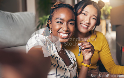 Image of Keys, couple of friends and new home selfie for moving in together for real estate investment. Rent, mortgage and loan of women with smile for social media portrait at apartment or house with partner