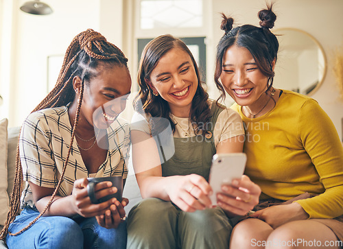 Image of Happy, women with funny meme and smartphone, friends relax at home with social media and communication. Gen z, happiness and comedy online, chat and using phone with people on couch, app and tech