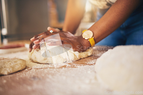 Image of Baking, hands and woman in a kitchen for bread, pizza or handmade food at home. Wheat, mix and female chef with messy fingers from cooking, fun and preparing diy, pasta or cake recipe in her house