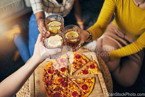 Image of Group hands, toast cocktail and pizza in home with celebration, party and closeup for alcohol, glass or juice. Friends, together and eating for event, culture or relax with success in lounge at house