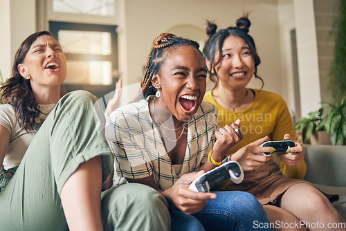 Image of Friends, women and gaming on tv, winner in home living room on sofa and smile, relax and bonding. Television, girls and celebration on video game success on couch, esports competition and excited