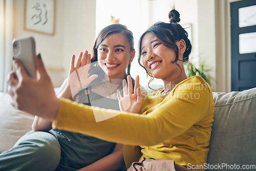 Image of Phone, wave and friends on video call on sofa, communication and conversation in living room of home. Smartphone, hello and happy women in webinar, virtual chat and girl in online meeting in house