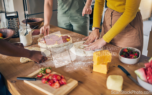 Image of Pizza, dough and hands on wooden table, people cooking with flour and cheese, fruit and food while at home. Nutrition, Italian meal and strawberry in kitchen, baking process with ingredients and chef