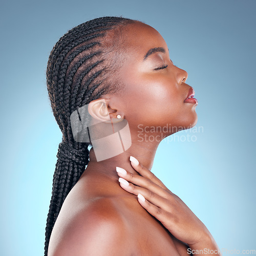 Image of Skin care, beauty and face of black woman with dermatology, makeup and manicure. Profile of African person on blue background with cosmetics, shine and facial glow with hand for soft touch in studio