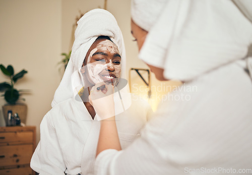 Image of Skincare, facial and women friends in a bedroom with mask, application and spa day bonding in their home. Beauty, cream and people with self care sleepover, lotion or cosmetic wellness on the weekend