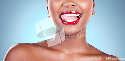 Image of Woman, tongue out and red lipstick, flirt and beauty with makeup closeup isolated on blue background. Playful, cheeky and model in a studio with bold cosmetic product, lips and cosmetology with shine