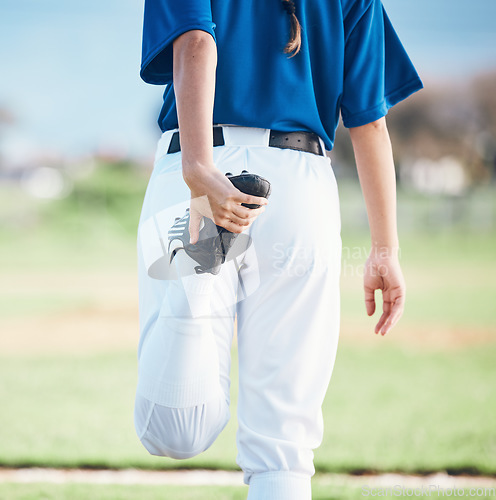 Image of Back, softball and athlete stretching legs at field outdoor in healthy body exercise. Warm up, hands and person prepare in sports training, wellness workout and fitness to start game or competition