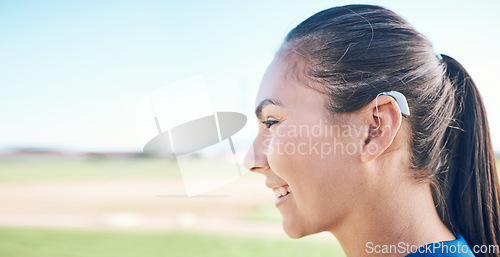 Image of Smile, profile and woman in hearing aid, ear and sound amplifier in mockup space at park outdoor. Happy, person with a disability and deaf tools in audio communication, tech and listening microphone