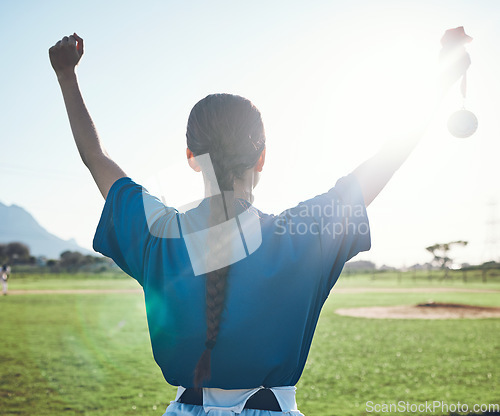 Image of Sports, success and woman back with baseball medal at a stadium for victory, celebration or award. Softball, reward and female winner celebrating fitness target, match or competitive game performance