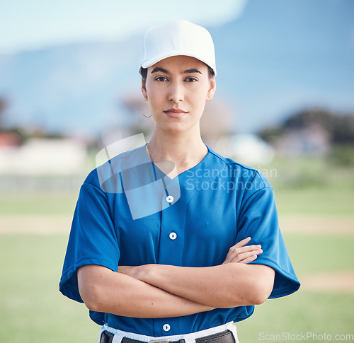 Image of Sports, portrait and woman with arms crossed for baseball field training, workout or match. Fitness, face and softball player at a park proud, serious and mindset focus against blurred background