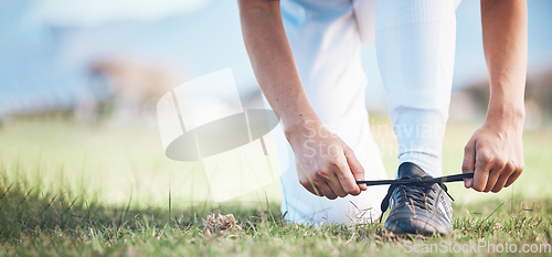 Image of Hands, feet and a sports person tying laces on a baseball field outdoor with mockup space for fitness. Exercise, shoes and getting ready with an athlete on a pitch for a match or training closeup