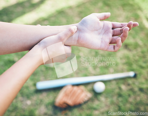 Image of Above, field and hand pain from baseball, sports and training for a competition with an injury. Fitness, burnout and a person or athlete with a muscle accident or arm strain after a softball match