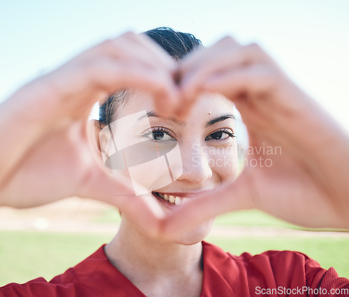 Image of Portrait, hands and woman with heart sign, support and like with emoji, social media and icon. Face, person and girl with symbol for love, shape and outdoor with care, health and gesture for romance