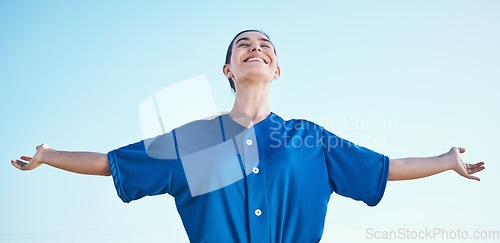 Image of Woman, arms out and winning, softball and athlete on outdoor, celebration and success with sports. Blue sky, freedom and happiness, baseball player and fitness with achievement, cheers and winner