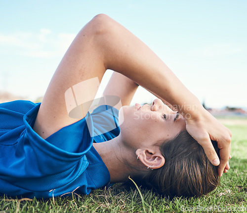 Image of Sports, fatigue and woman with headache on a baseball field for anxiety, stress or exhaustion. Fitness, migraine and softball player on the ground with training tension, pain or mental health crisis