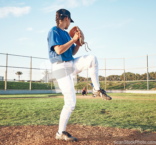 Image of Sports person, pitching and baseball outdoor on pitch for performance and competition. Behind professional athlete or softball player for team game, training or exercise challenge at field or stadium