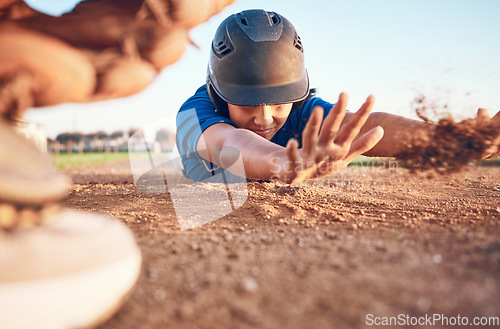 Image of Slide, baseball action and player in a match or game for sports competition on a pitch in a stadium. Man, ground and tournament performance by athlete or base runner in training, exercise or workout