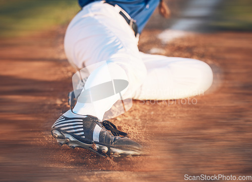 Image of Slide, baseball action and athlete in a dirt for game or sports competition on pitch in stadium. Person, ground and tournament performance by athlete or base runner in training, exercise or workout