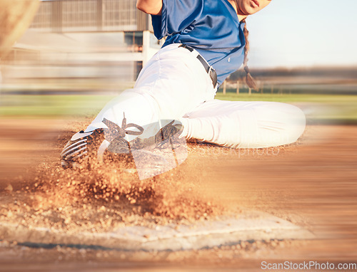 Image of Slide, softball action and player in match or game for sports competition on a pitch in a stadium. Goal, ground and tournament performance by athlete or base runner in training, exercise or workout