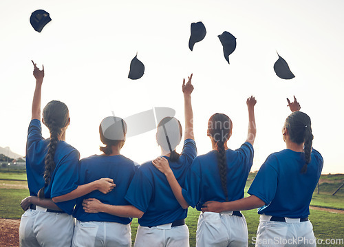 Image of Baseball player, team and celebrate win outdoor with women on a pitch for sports competition. Behind professional athlete or softball group with success, winning or achievement and throw cap at game