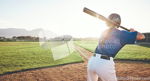 Image of Bat, baseball and person swing outdoor on a pitch for sports, performance and competition. Behind professional athlete or softball player for game, training or exercise challenge with stadium banner