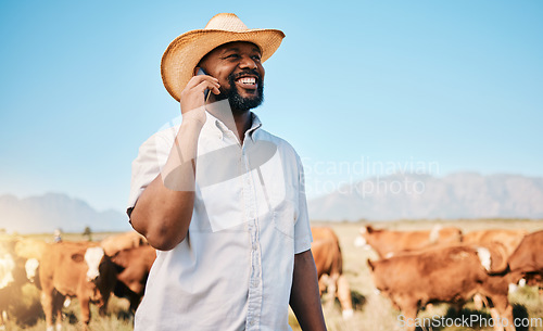 Image of Happy black man, phone call and animals in countryside for farming, communication or networking. African male person smile and talking on mobile smartphone for conversation or discussion at the farm