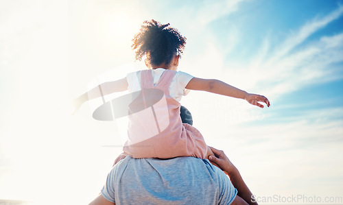 Image of Child on father shoulders, beach and family with love, travel and back view with freedom and fun together outdoor. Nature, adventure with man and young girl bond on tropical holiday and sunshine