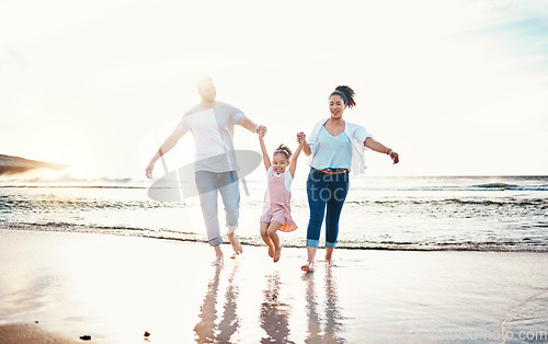 Image of Mom, dad and swing girl on beach, holiday and vacation in Florida for bonding, adventure and family together in waves. Mother, father and child at sunset in ocean, sea or playing in water for fun