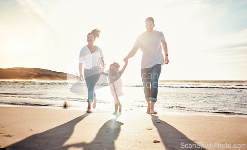 Image of Family, beach and holding hands, parents and kid with travel and bonding, love and walking together in nature. Vacation, ocean and happy people outdoor, parents and child with sun and adventure