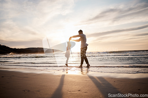 Image of Love, swing and father with girl child at a beach holding hands in nature for play, freedom or bond at sunset. Ocean, travel and parent with kid at sea for spinning fun, games or celebration in Bali