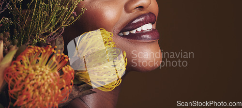 Image of Beauty, makeup and plants with lips of black woman in studio for natural, spa and mockup space. Cosmetics, flowers and closeup with model on brown background for sustainability, glow and banner