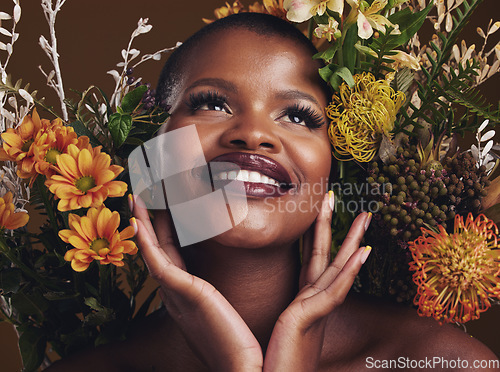 Image of African woman, plants and ideas in studio with flowers for beauty, wellness or smile for glow by brown background. Girl, model and face for thinking, leaves or memory for cosmetics, skin or aesthetic