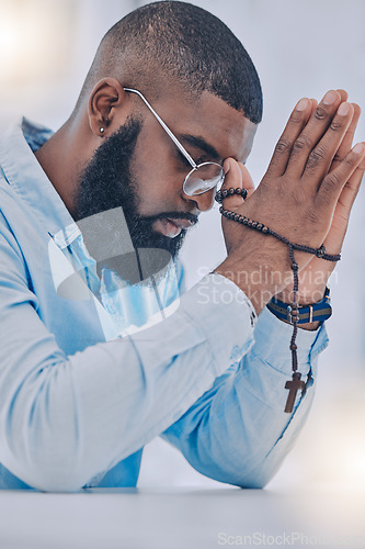 Image of Rosary, black man and hands with praying beads, religion and christian respect with gratitude and support. Help, praise or holy spirit healing of a person with spiritual necklace, prayer and cross