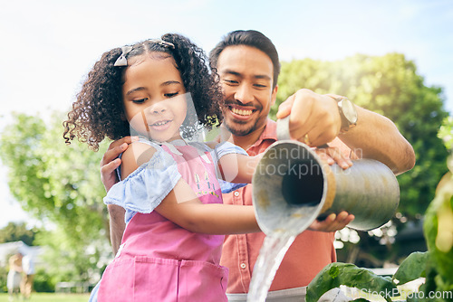 Image of Gardening, dad and girl watering plants, teaching and learning growth in nature together. Backyard, sustainability and father helping daughter water vegetable garden with love, support and kids fun.